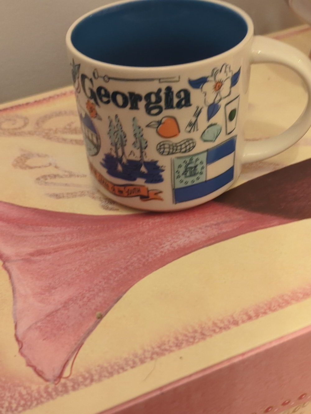 Starbucks Georgia Ceramic Mug with Blue Interior and White Exterior
